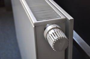 Do Heat Pumps Work With Radiators Featured image - Thermostat White radiator