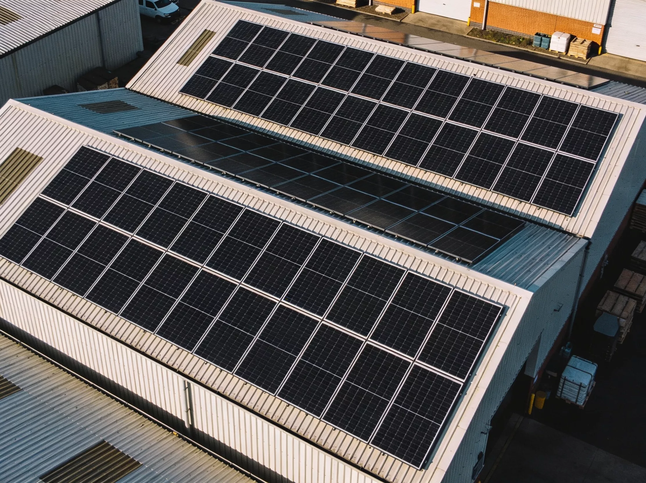 Commercial solar panels Wales on a warehouse roof