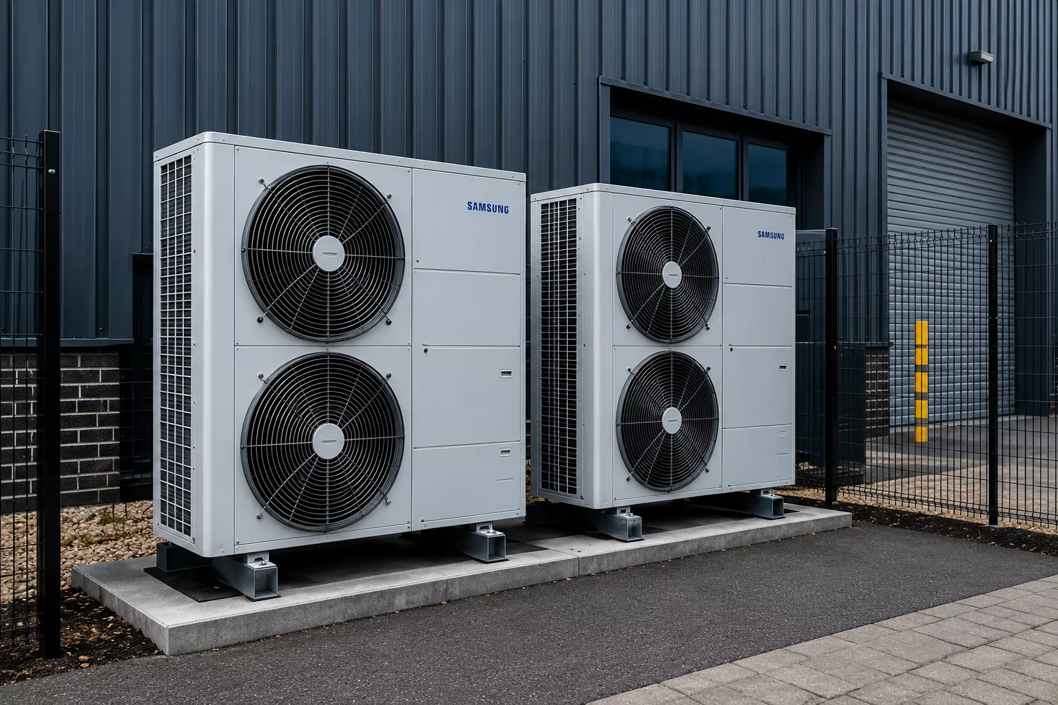 external commercial heat pump units installed beside an industrial building